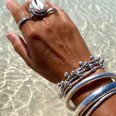 Bracelet and ring stack including favourites girl of the ocean ring and sea bubbles wrap, designed by embella jewellery